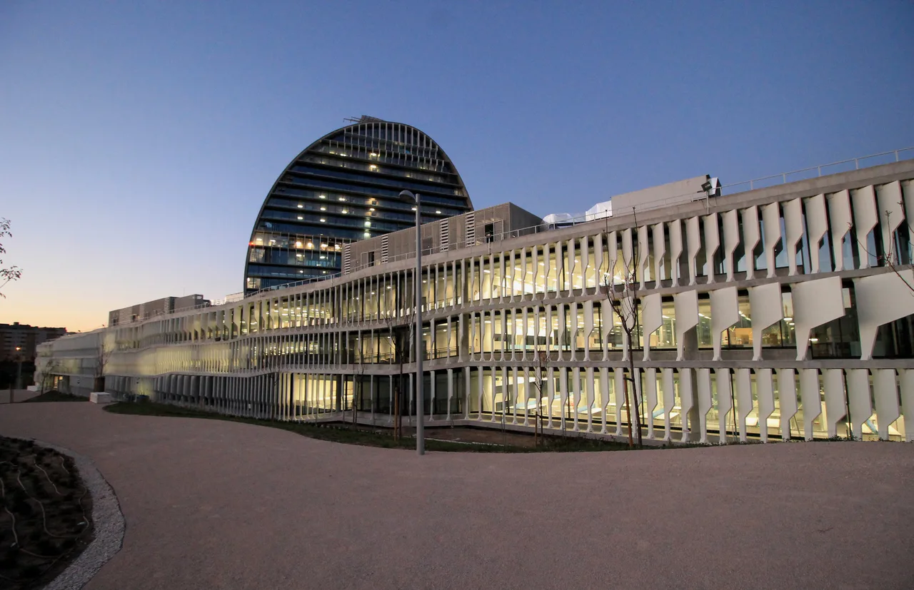 Illuminated facade of BBVA head offices in Madrid.