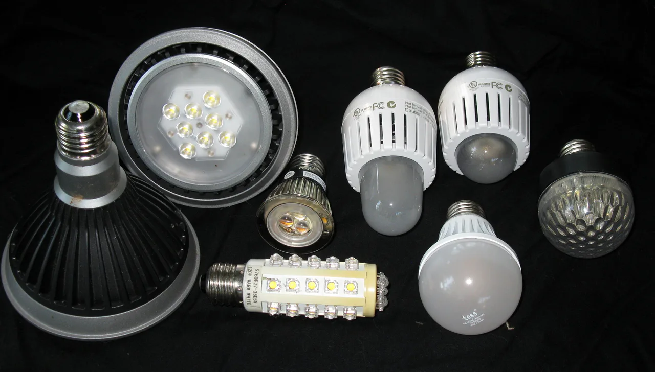 Selection of LED light bulbs and lamps against a dark background