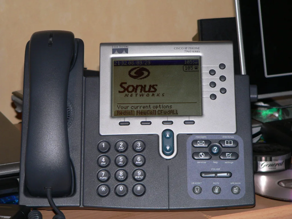 A Cisco 7960 IP desk phone with handset, keypad and the Sonus Networks logo on its screen