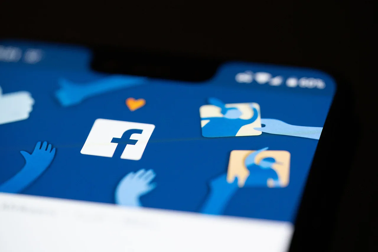 The Facebook logo appears on an Android phone screen.